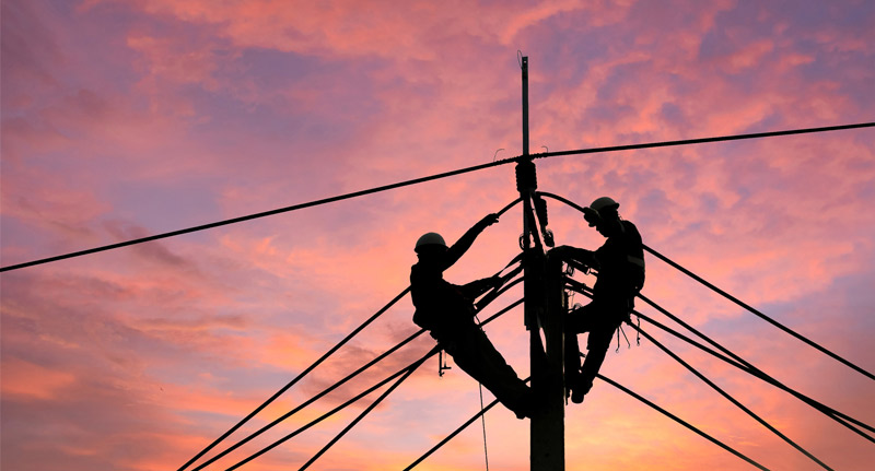 electrical man on top of pole lines | pole line installations